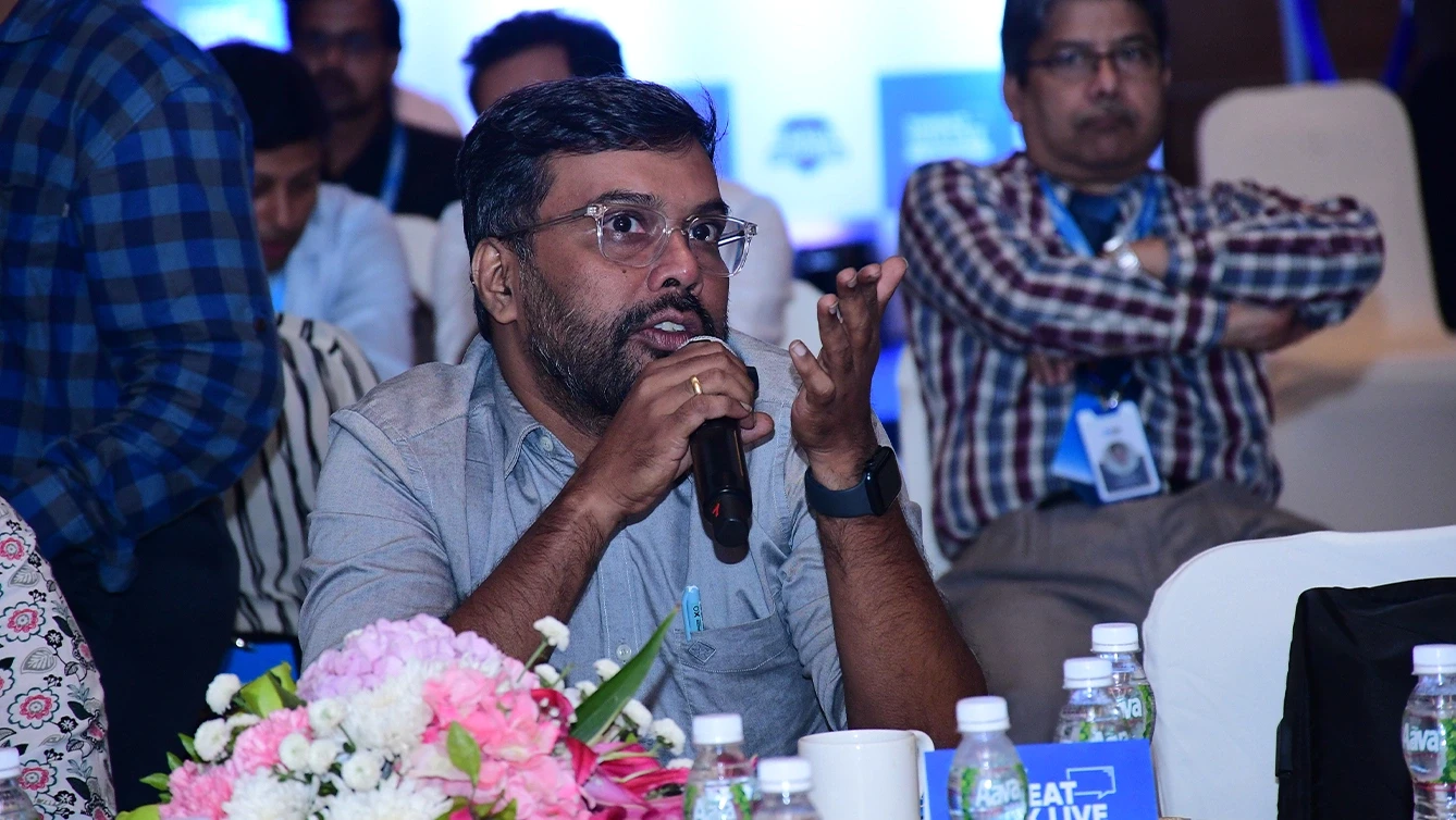 Audience member asking question during conference