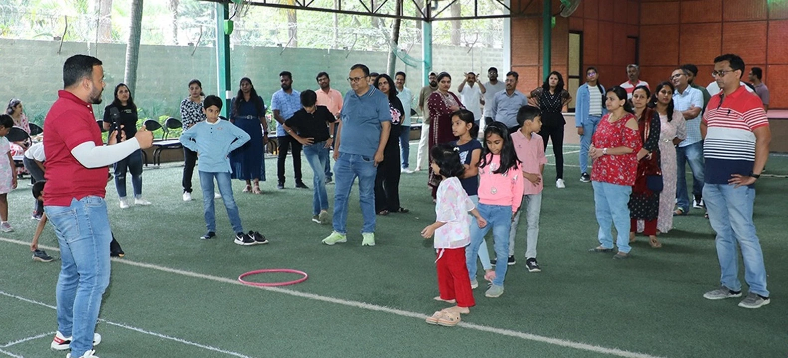 Group of families playing games at indoor sports area