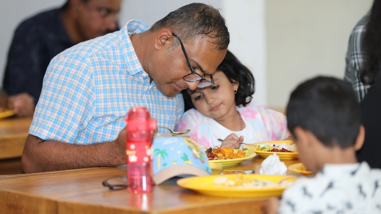 Father and daughter enjoying meal together